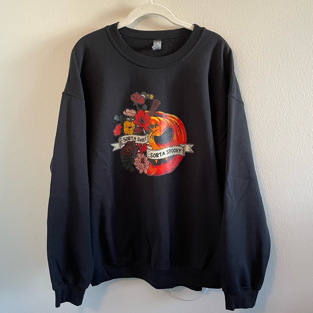 Slightly sweet slightly spooky unisex sweatshirt. Size XL. NWOT.